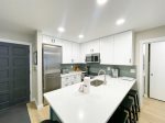 Kitchen with stainless steel appliances and quartz counters